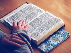 Lady reading open Bible