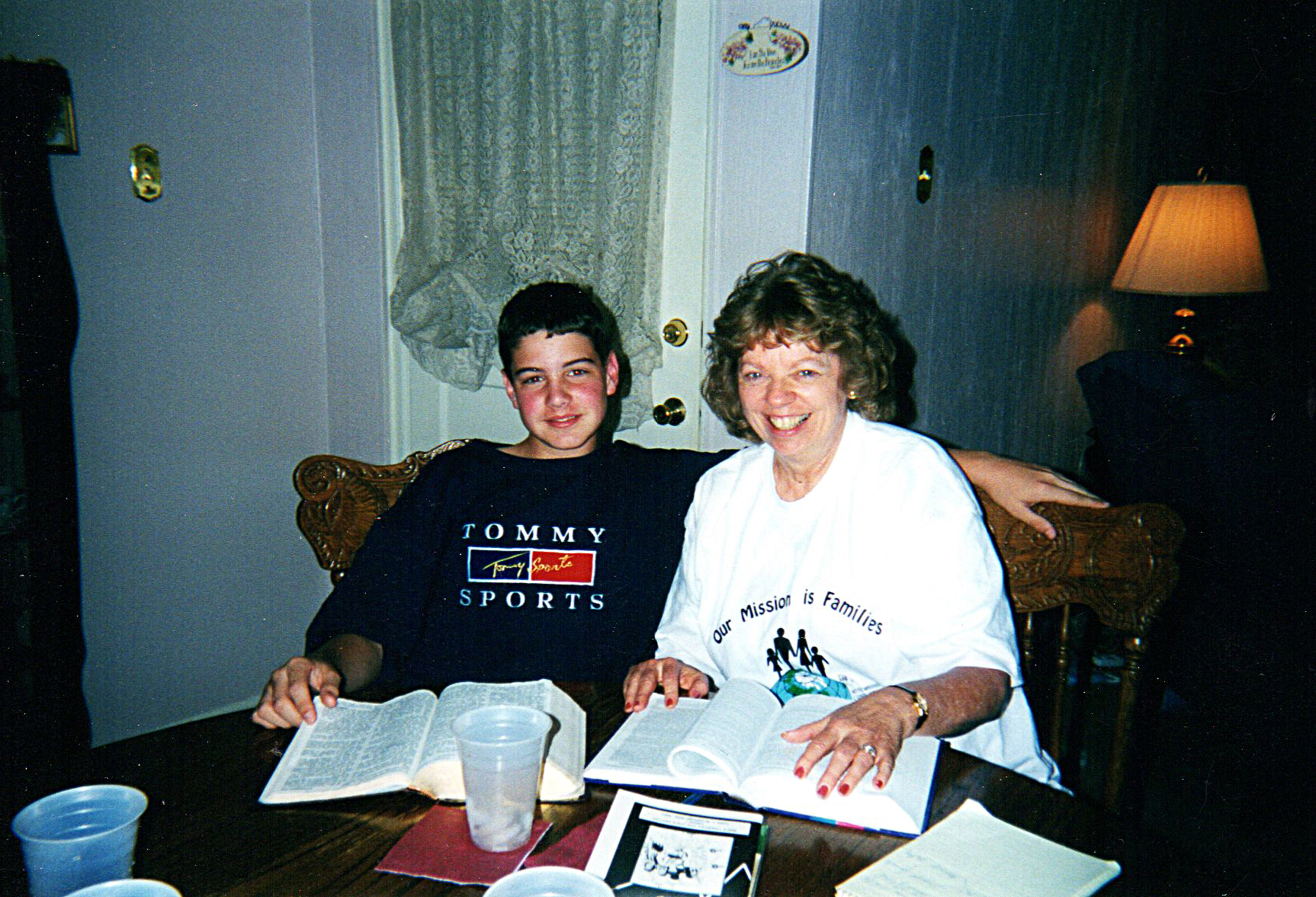 Home Bible Study woman teaching teenager Bible